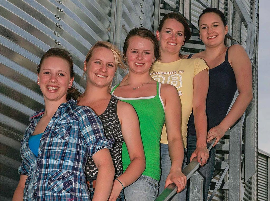 young women on stairwell next to silo