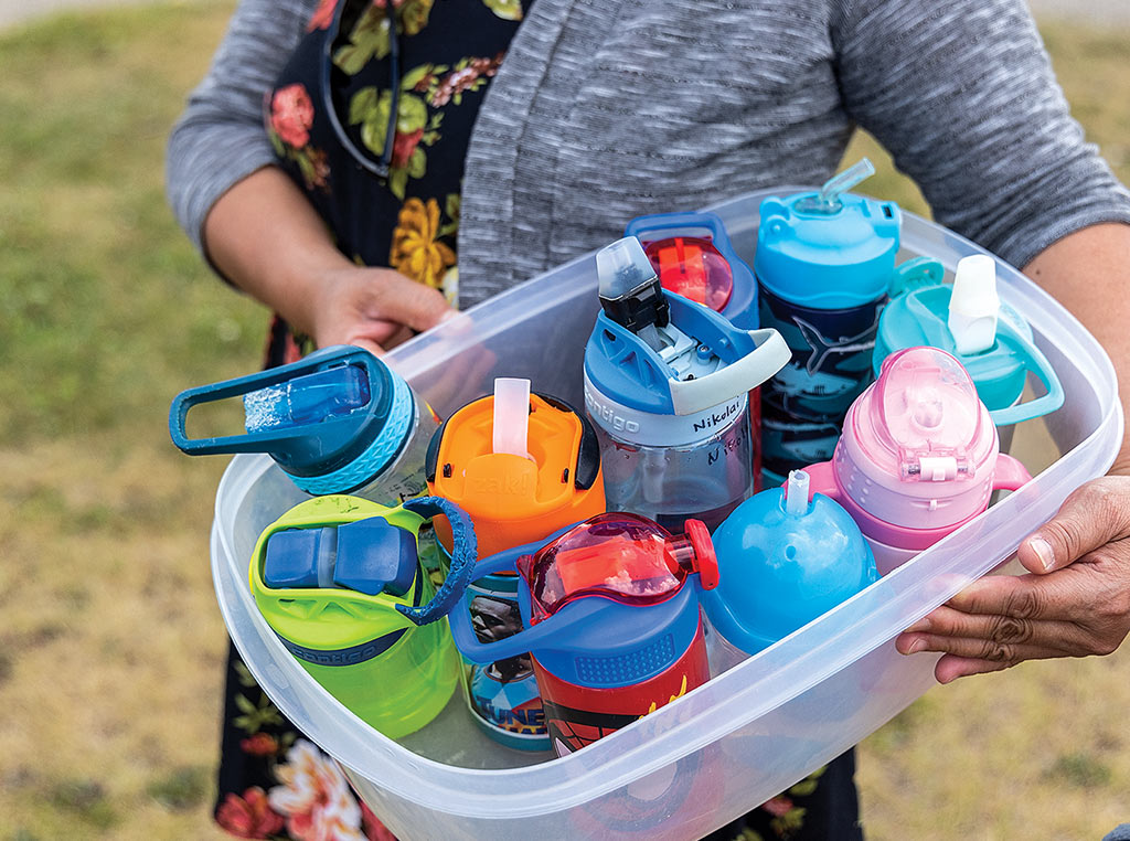 water bottles in plastic bin