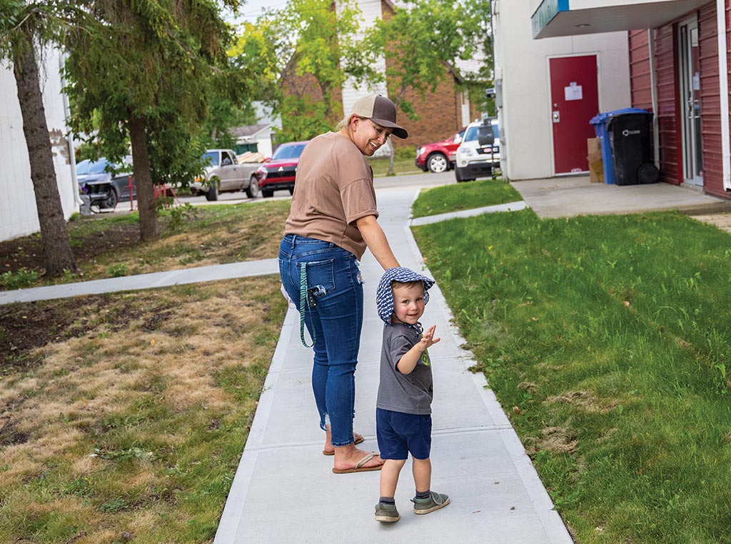 parent walking away with child from daycare