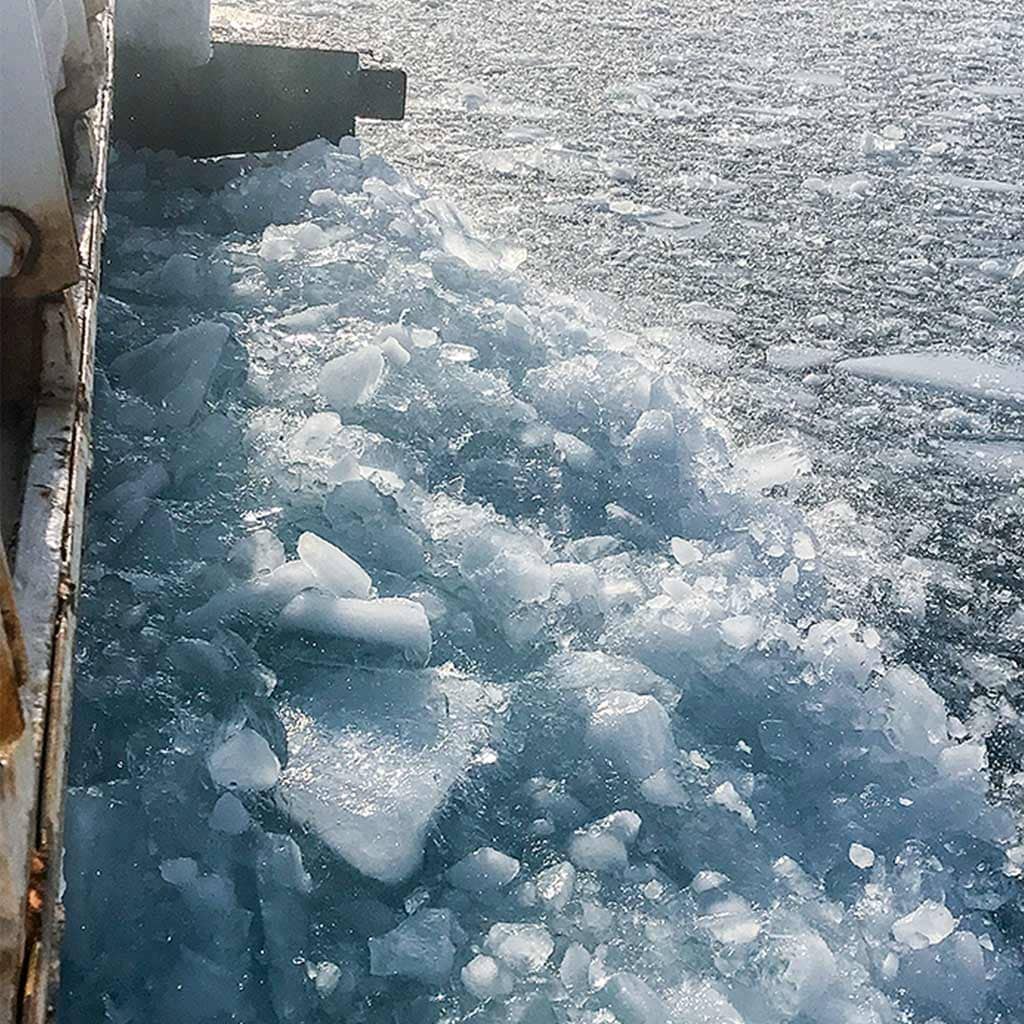 breaking ice with machinery