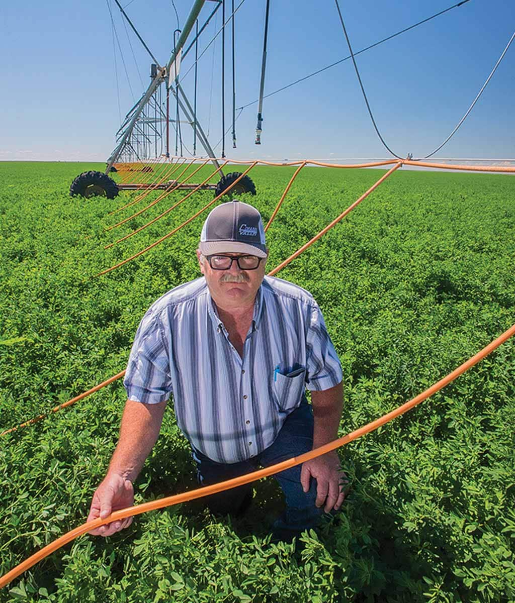 a man irrigating a field