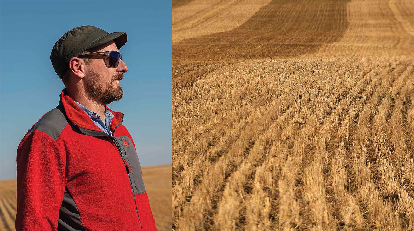 profile of man smiling and golden field with blue sky