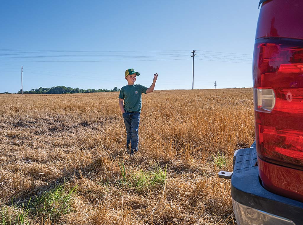 boy guiding truck backing up