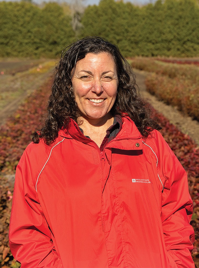 woman in red jacket smiling