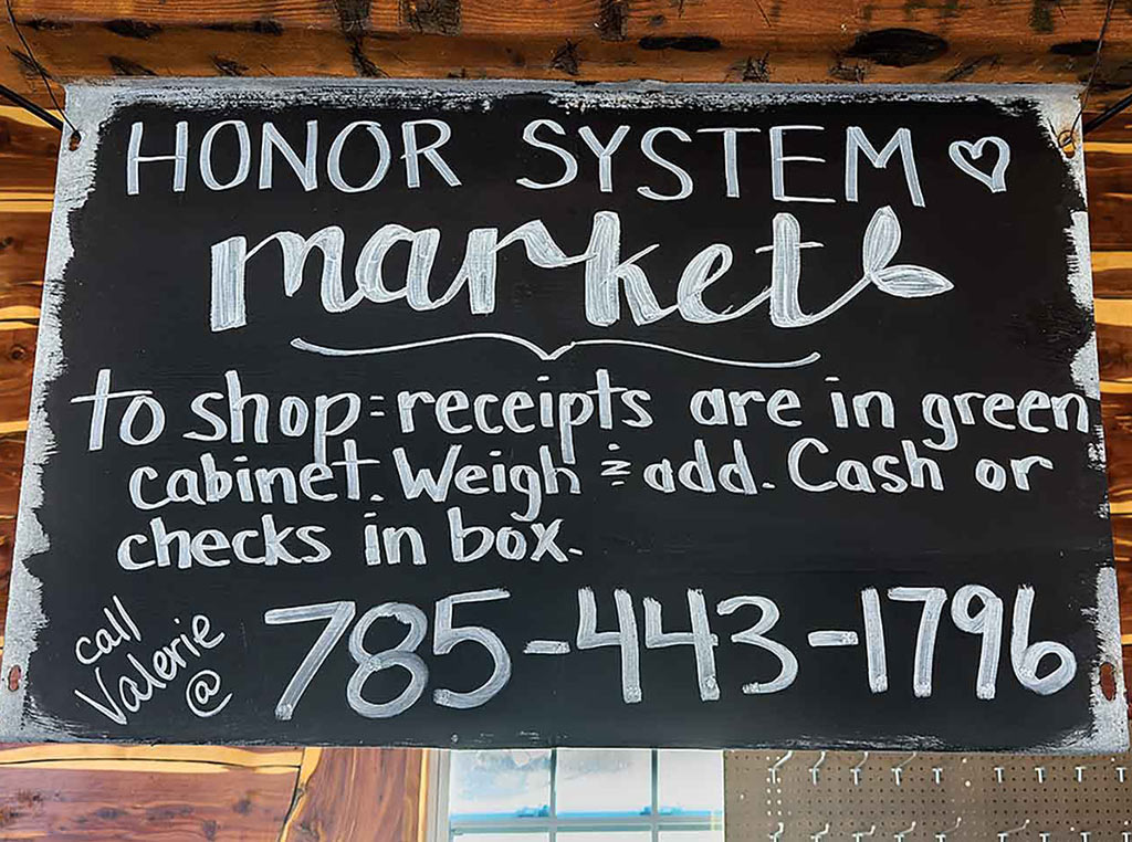 a chalkboard with the market's information written on it