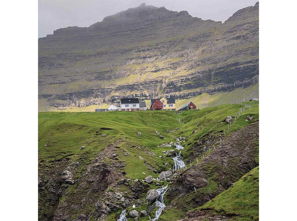 mountain landscape with waterfall in the foreground