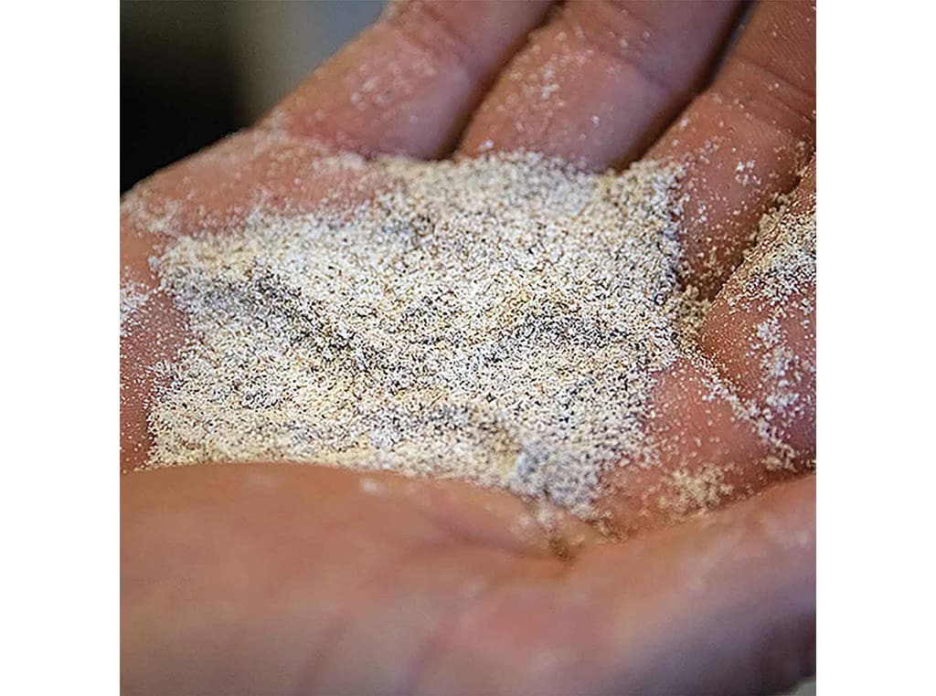 closeup of flour in the palm of a hand