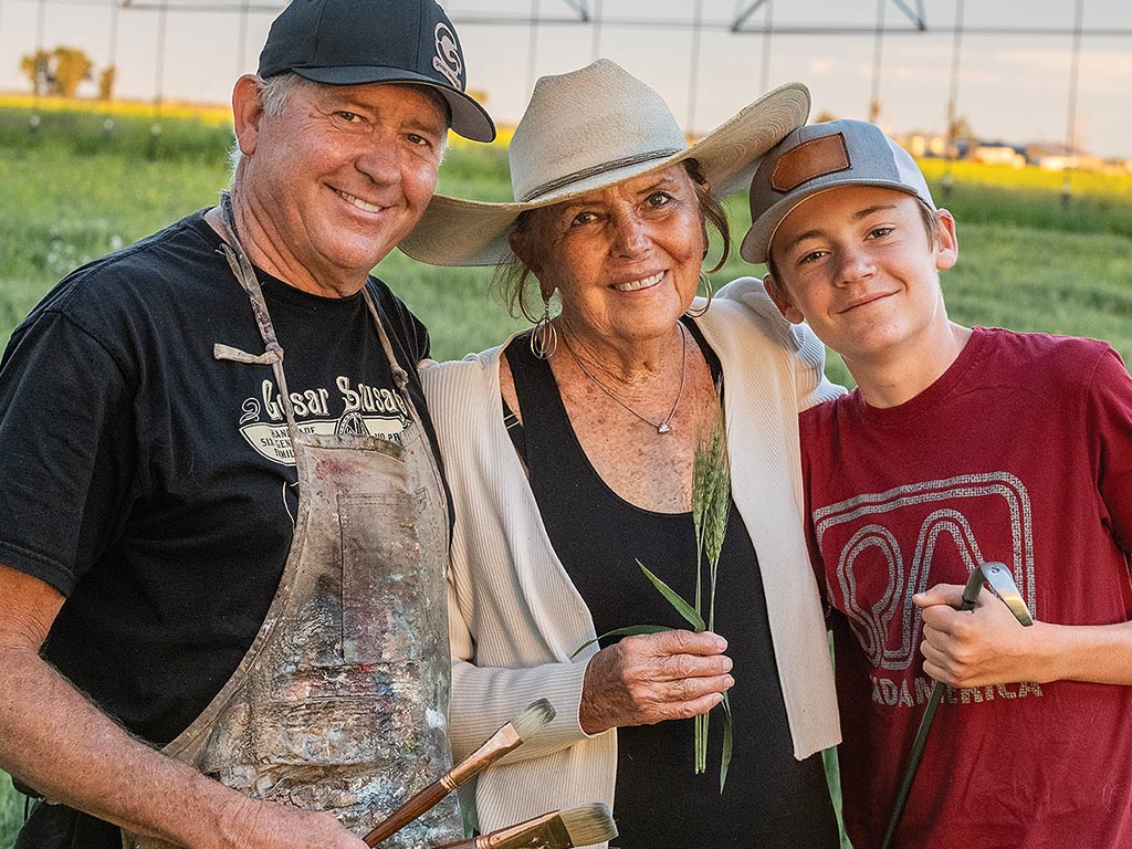 three people smiling