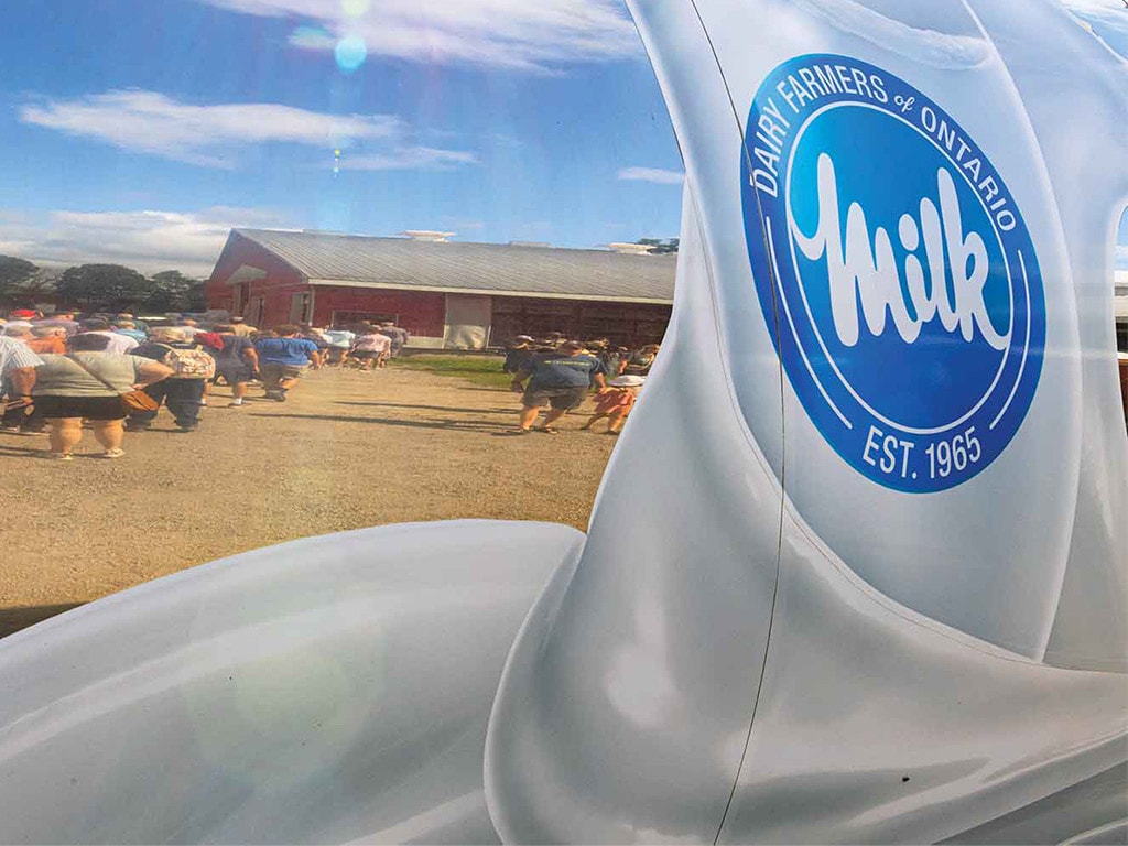 reflection of people standing in line for a farm breakfast