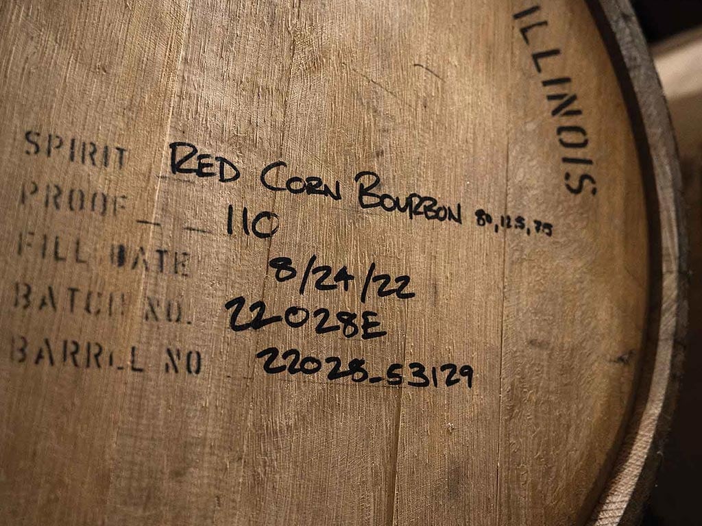 Closeup of a whiskey barrel with writing on it