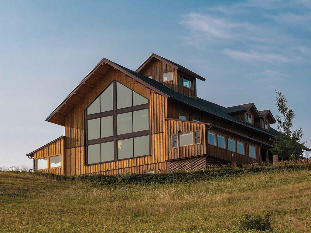 A hilltop lodge with many windows