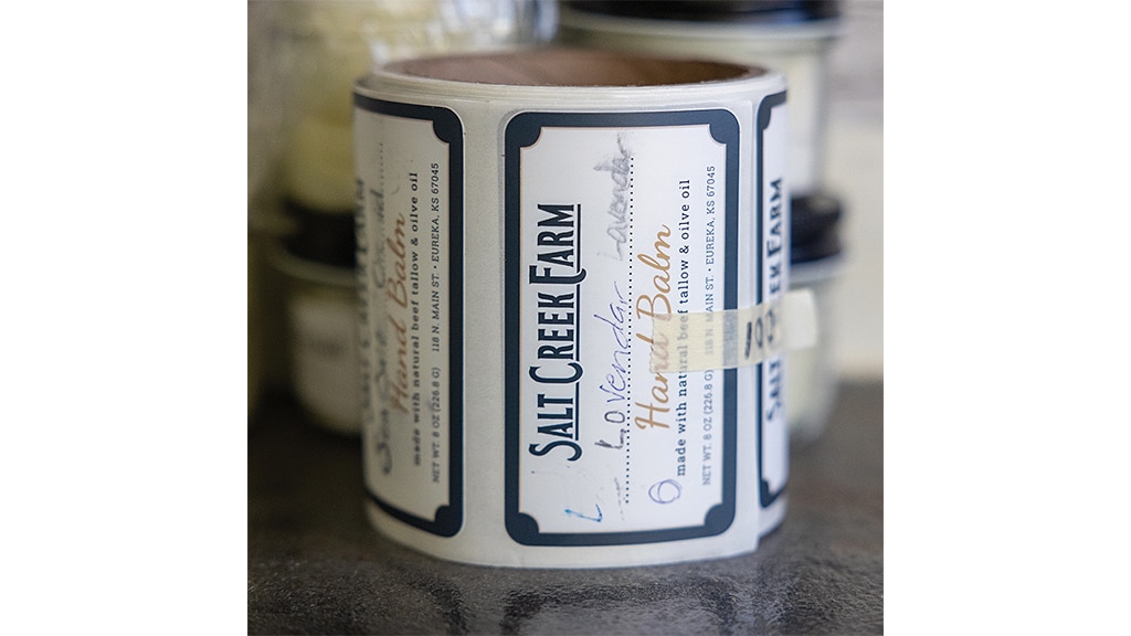 closeup of round box labelled hand balm