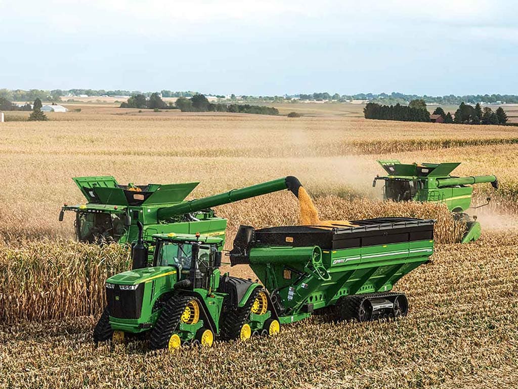 Harvesting machines at work in a field