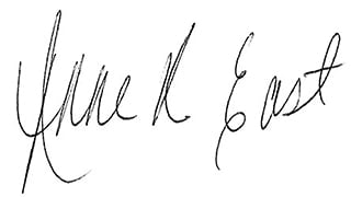 Handwritten signature on a white background.