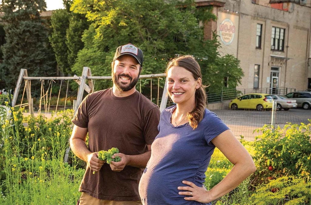 photo of couple in a garden smiling