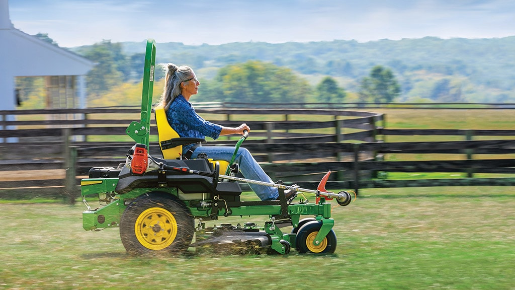 Woman mowing with a zero-turn mower