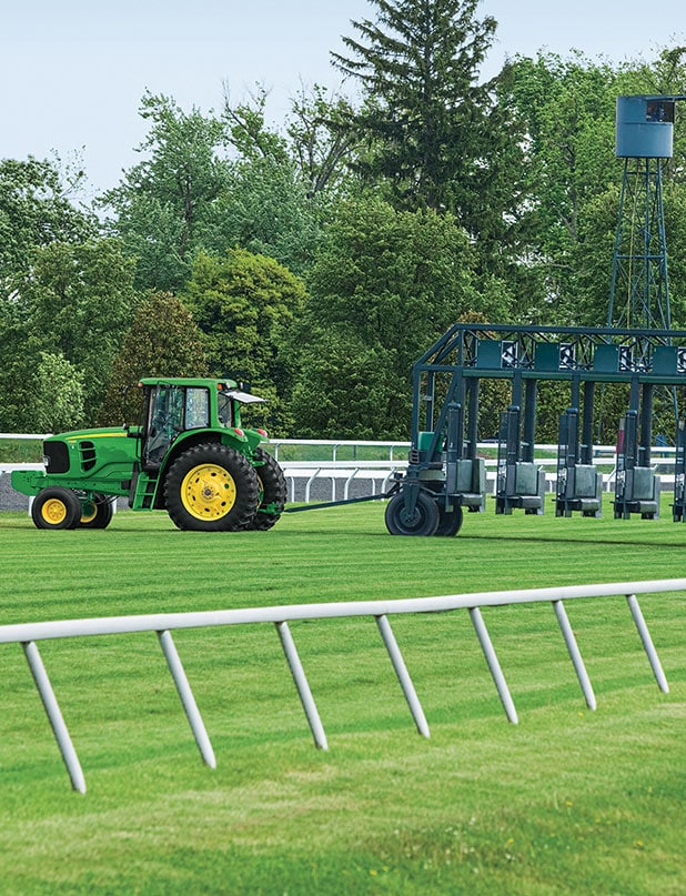 john deere tractor on racetrack