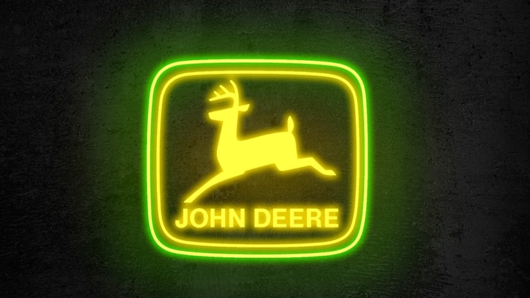 John Deere logo on a neon sign